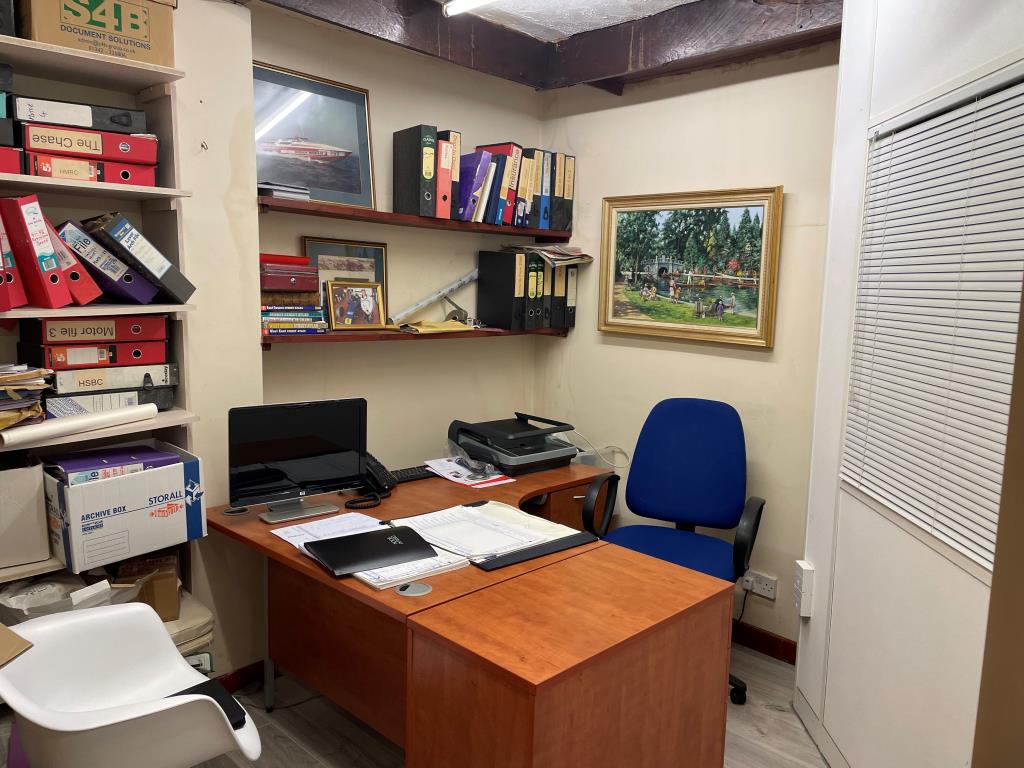 Lot: 79 - FREEHOLD SHOP AND FLAT WITH UPPER PARTS - rear office 2 with internal window